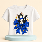 Bow-Tied Cat Women's Graphic Crop Tee featuring a playful black-and-white cat perched on an oversized blue bow, product view 3