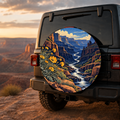 Wildflower Canyon River Spare Tire Cover featuring golden wildflowers framing a river through a sunlit red-rock canyon